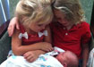 The girls saying hello to the newest family member.