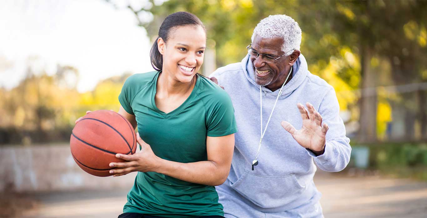 Father and Daughter Playing Basketball