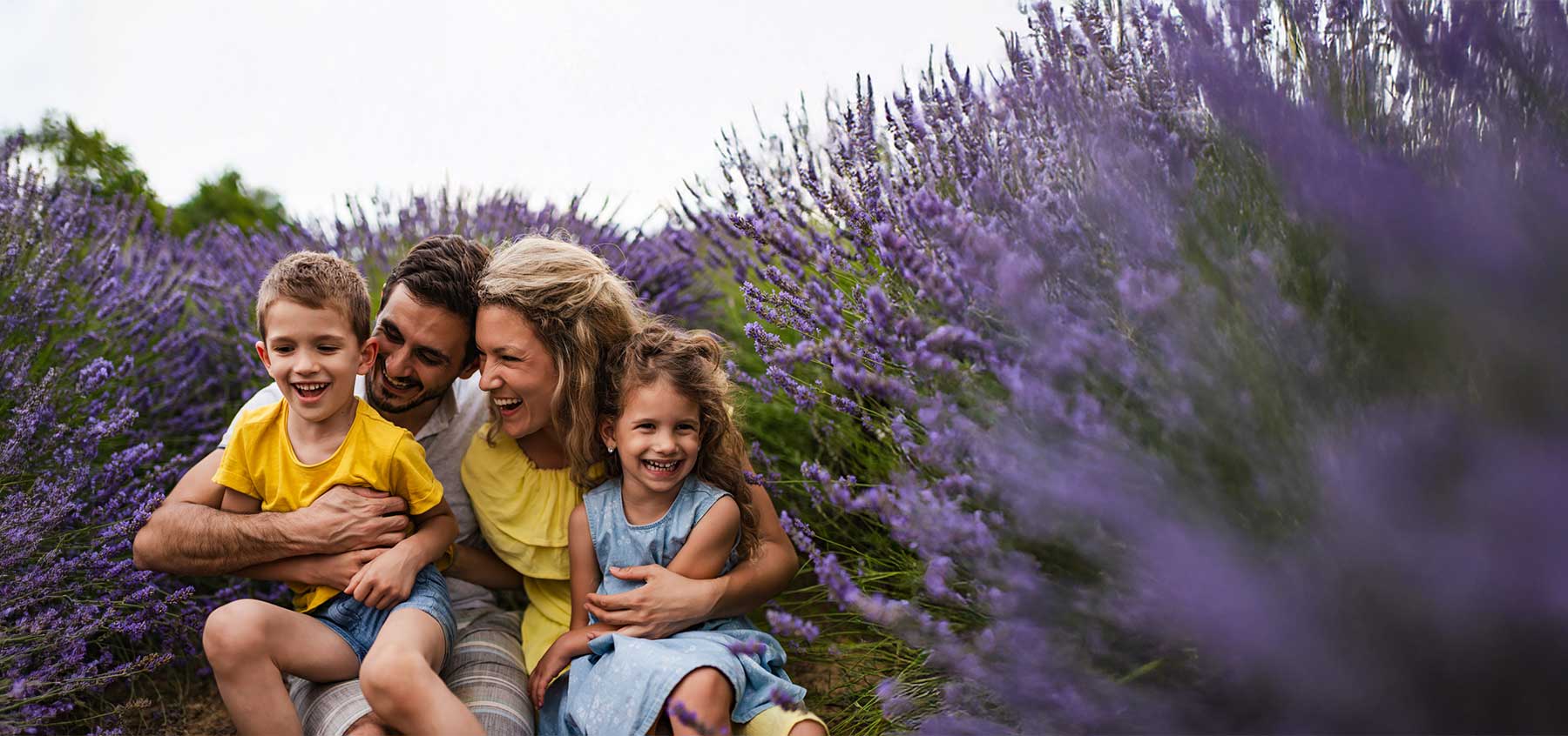 Young family enjoying on lavender field